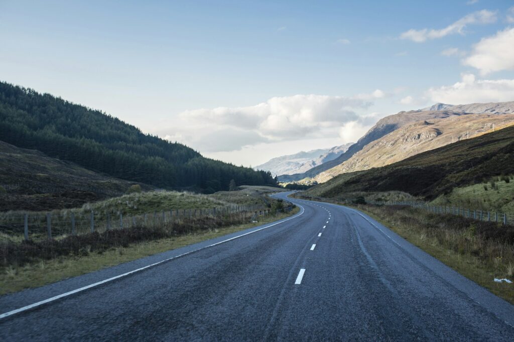 Open winding road in mountains, Scotland, UK